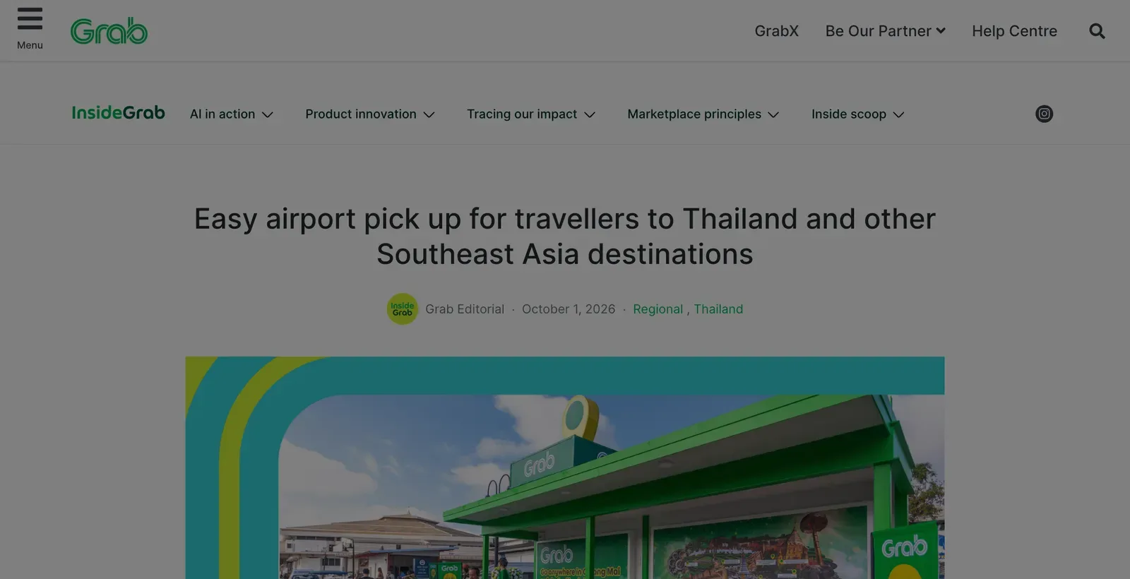 Grab airport pick-up story page with a Grab car beside a green pick-up shelter