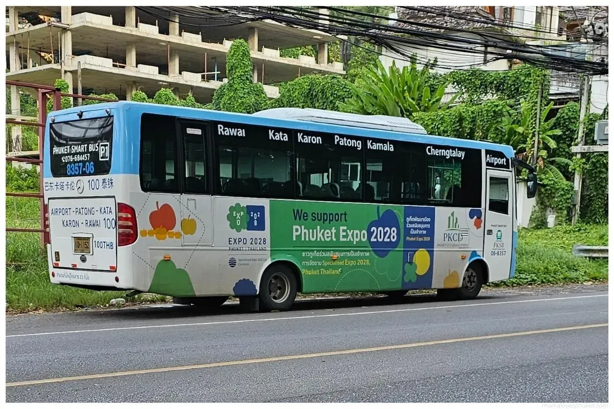 Phuket Smart Bus seen from behind and the side, with the airport to Rawai route and its flat fare printed on the back.
